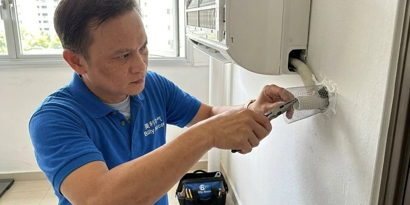 Aircon drain pipe and gaps showing entry points for pests with mesh seal