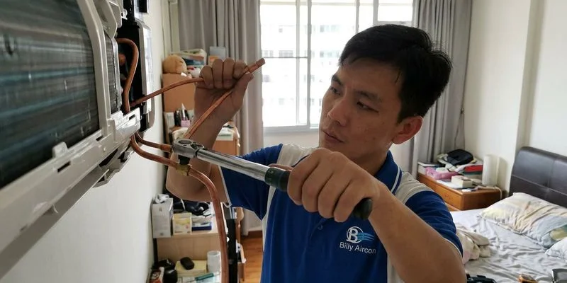 Aircon copper pipe flare fitting connection at the indoor unit showing proper torque